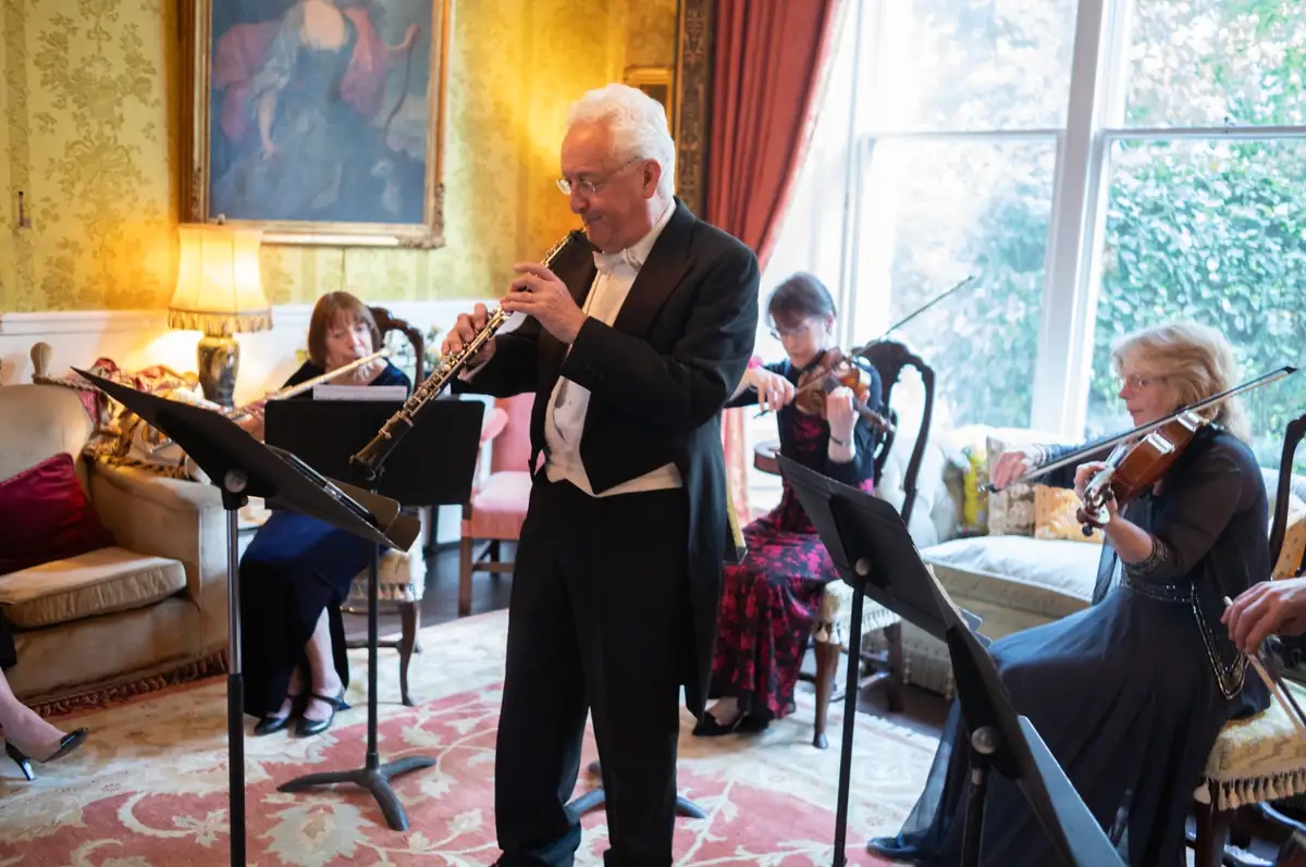 Musicians of the London Chamber Orchestra performing in a drawing room in The Boltons